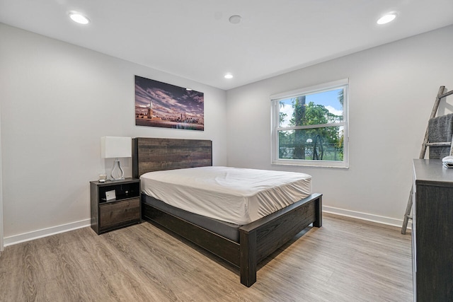 bedroom with light wood-type flooring