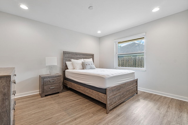 bedroom with light hardwood / wood-style floors