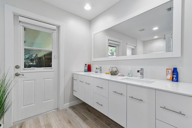 bathroom featuring vanity and hardwood / wood-style flooring