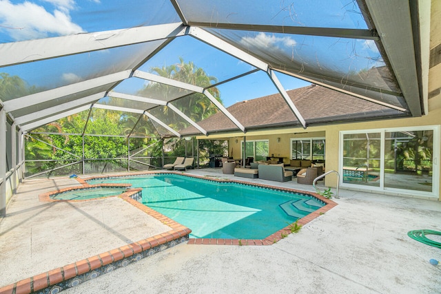 view of swimming pool featuring an in ground hot tub, an outdoor living space, glass enclosure, and a patio area