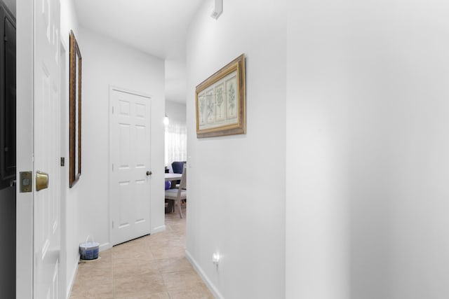 hallway with light tile patterned floors