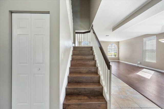 stairway featuring tile patterned floors