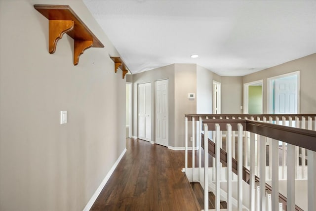 hall with dark hardwood / wood-style flooring