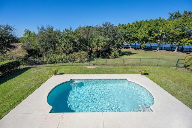 view of pool with a lawn