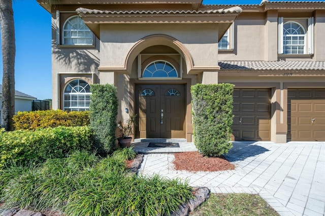 doorway to property featuring a garage