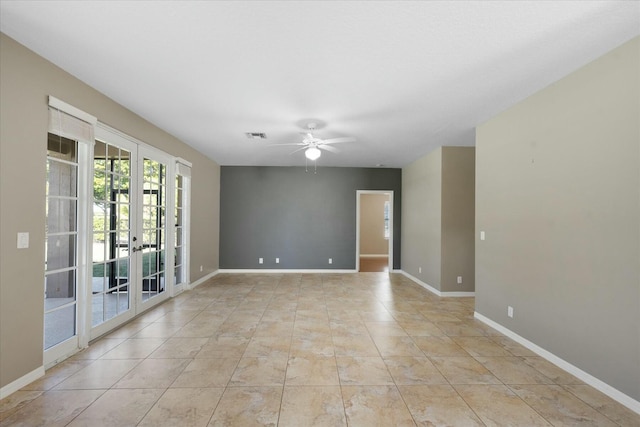 unfurnished room with ceiling fan, french doors, and light tile patterned floors