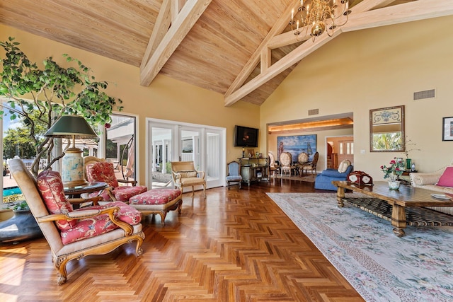 living area with visible vents, high vaulted ceiling, a healthy amount of sunlight, and a notable chandelier