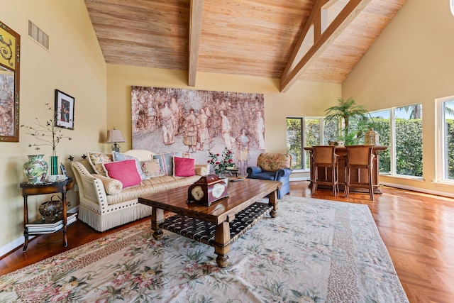 living area with visible vents, beamed ceiling, high vaulted ceiling, and baseboards