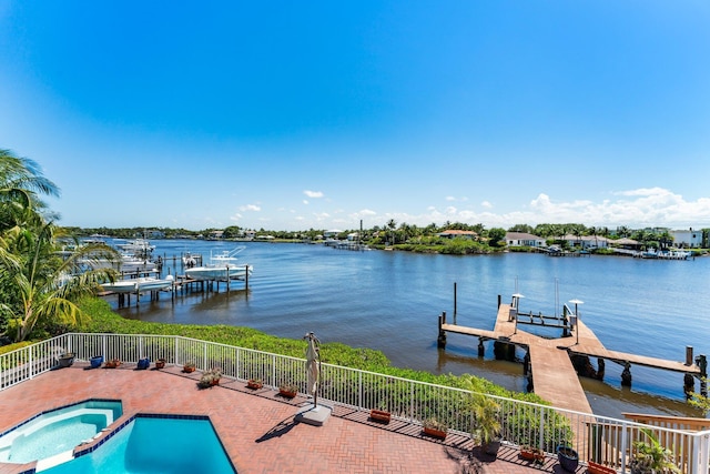 view of dock featuring a water view and a pool with connected hot tub