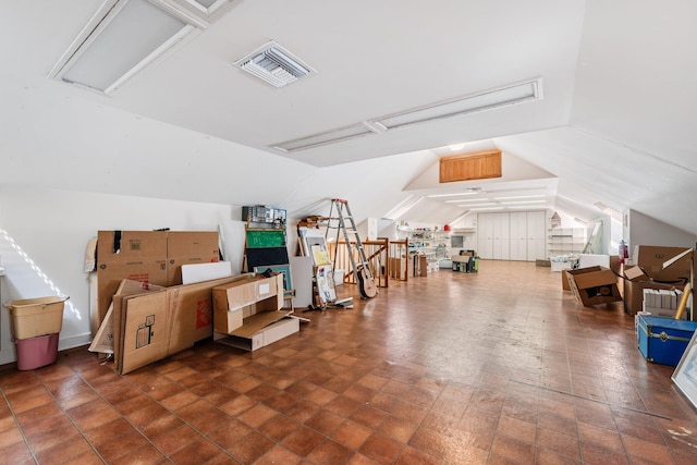 additional living space with vaulted ceiling and visible vents