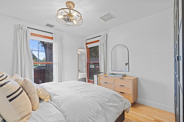 bedroom featuring light wood-type flooring