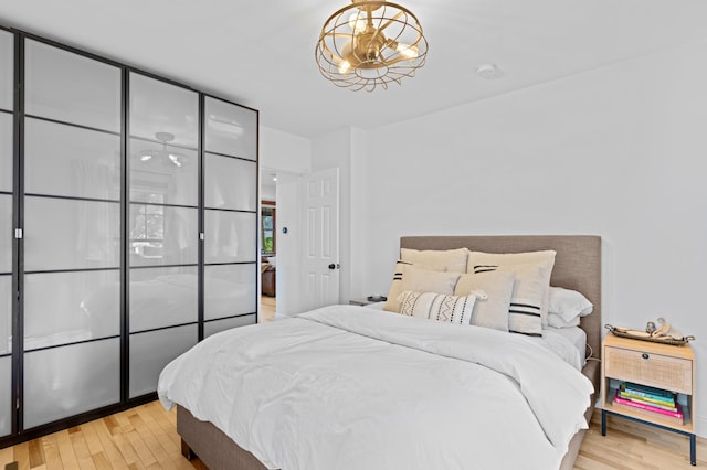 bedroom with light wood-type flooring