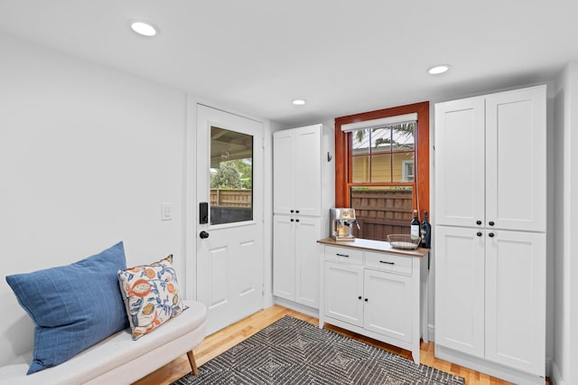 mudroom with hardwood / wood-style floors