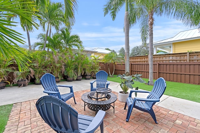 view of patio with an outdoor fire pit