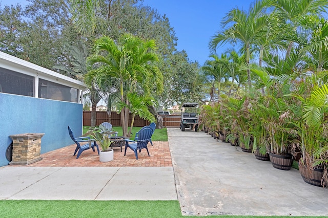 view of patio / terrace featuring a sunroom