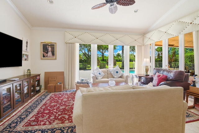 living room with lofted ceiling, ceiling fan, crown molding, and french doors