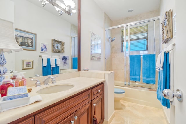 full bathroom with tile patterned floors, toilet, vanity, and combined bath / shower with glass door