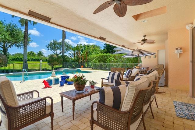 view of patio / terrace with ceiling fan, a fenced in pool, and outdoor lounge area