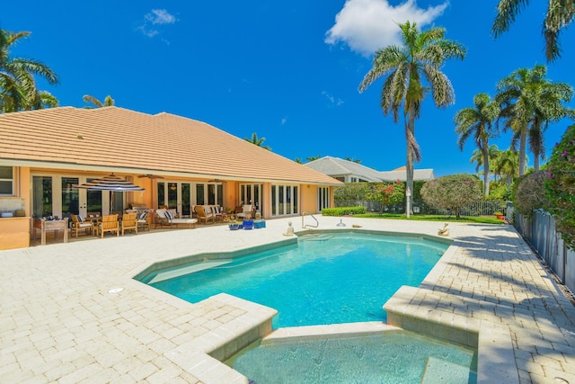 view of swimming pool with outdoor lounge area and a patio