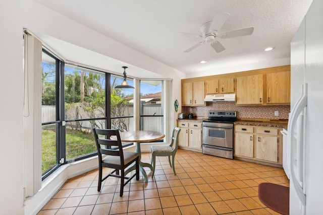 kitchen with backsplash, ceiling fan, pendant lighting, stainless steel electric range oven, and white fridge with ice dispenser