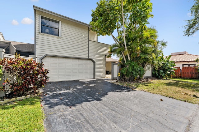 view of front facade with a front lawn and a garage