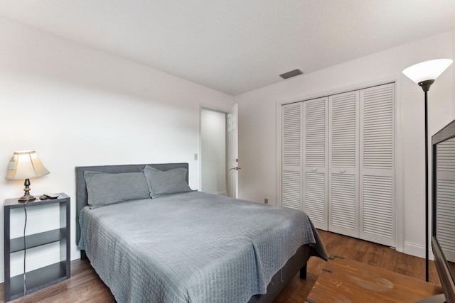 bedroom featuring a closet and hardwood / wood-style flooring