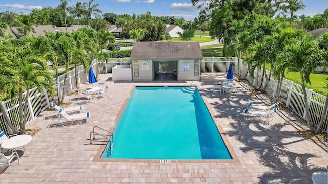 view of pool featuring a patio area and an outdoor structure