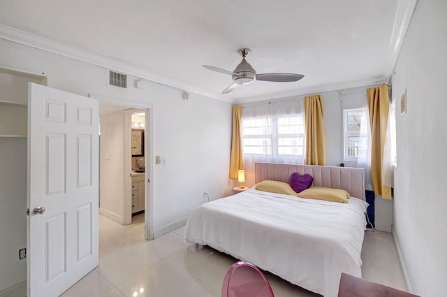 tiled bedroom featuring ceiling fan, ornamental molding, and ensuite bathroom