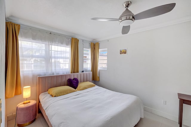 bedroom with ceiling fan, ornamental molding, and light tile patterned floors