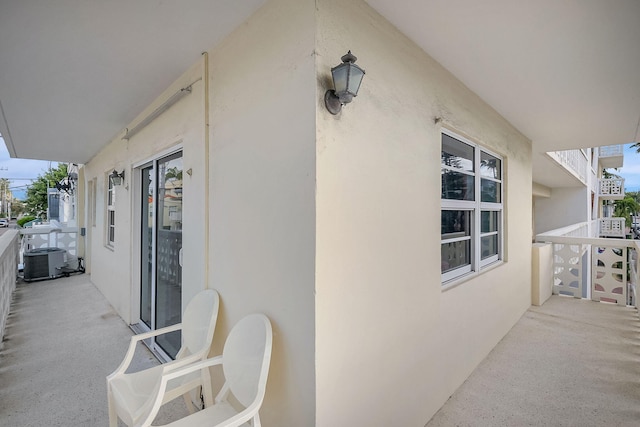 view of patio / terrace with a balcony and central AC unit