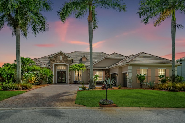 view of front of property with a yard