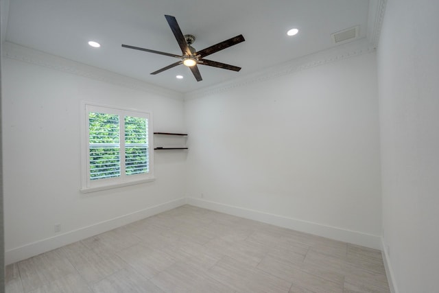 unfurnished room with ceiling fan and crown molding