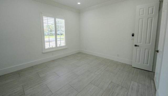 unfurnished room featuring ornamental molding