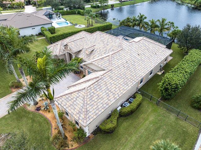 birds eye view of property with a water view