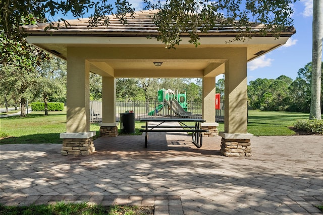 surrounding community with a gazebo, a yard, and a playground