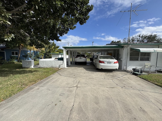 view of front of house featuring a front yard and a carport