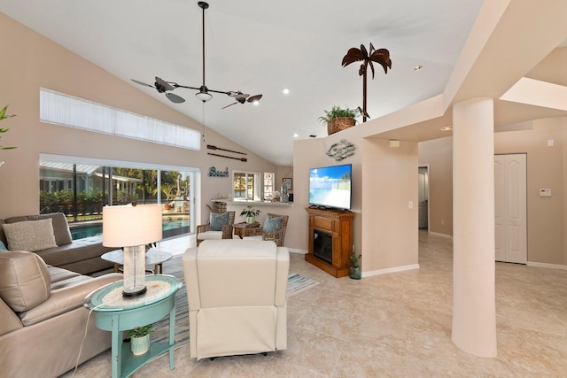 living room with ceiling fan, a fireplace, and high vaulted ceiling