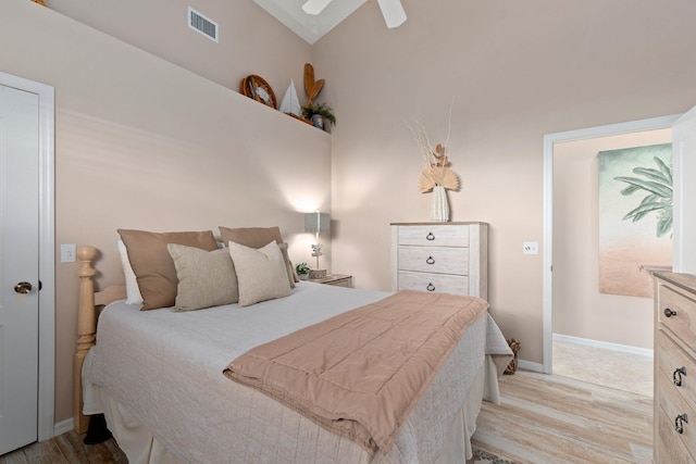 bedroom featuring vaulted ceiling, light hardwood / wood-style flooring, and ceiling fan