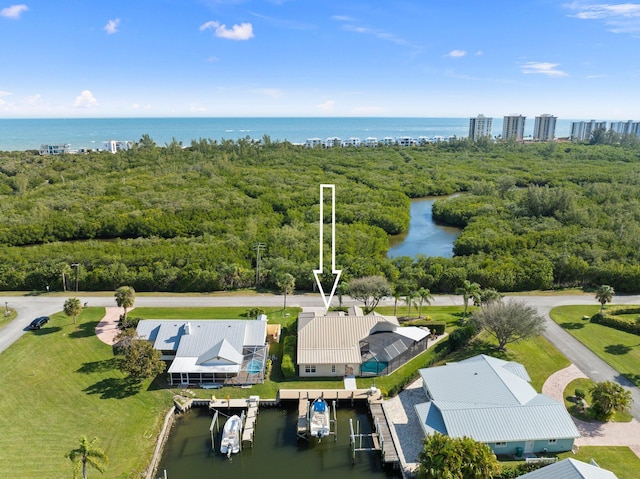 birds eye view of property with a water view