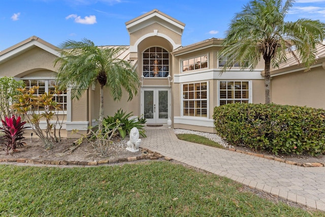 back of property featuring french doors