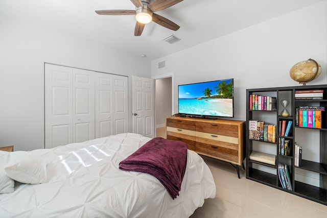 bedroom with ceiling fan and a closet