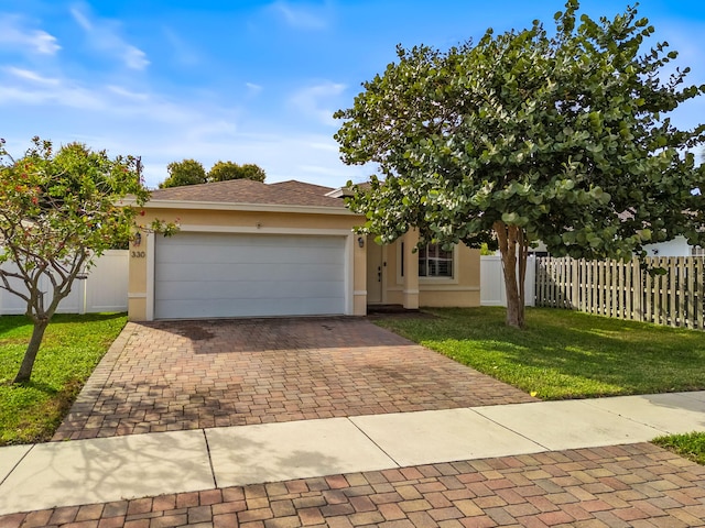 view of front facade featuring a front yard and a garage