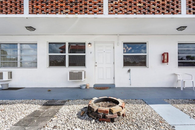 property entrance with a patio area