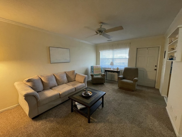 carpeted living room featuring ceiling fan, built in shelves, and crown molding