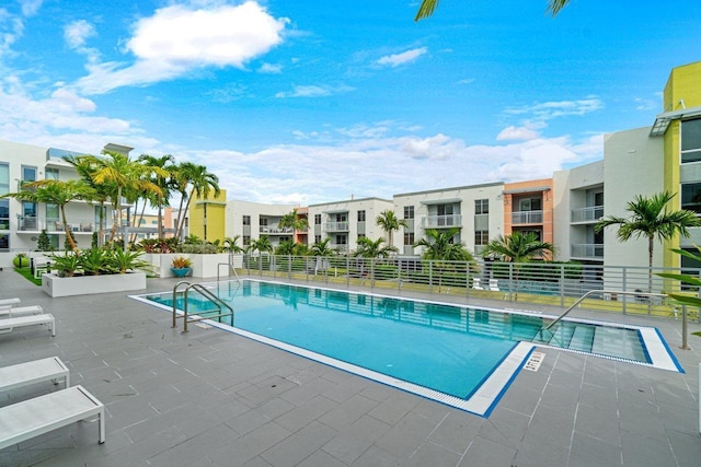 view of swimming pool featuring a patio area