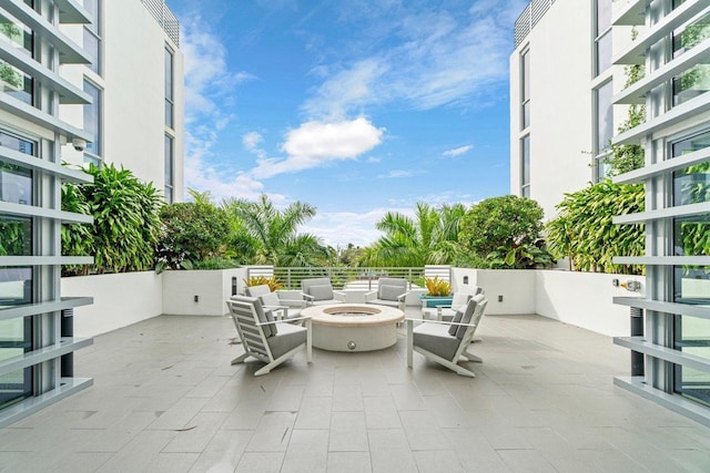 view of patio / terrace featuring an outdoor fire pit