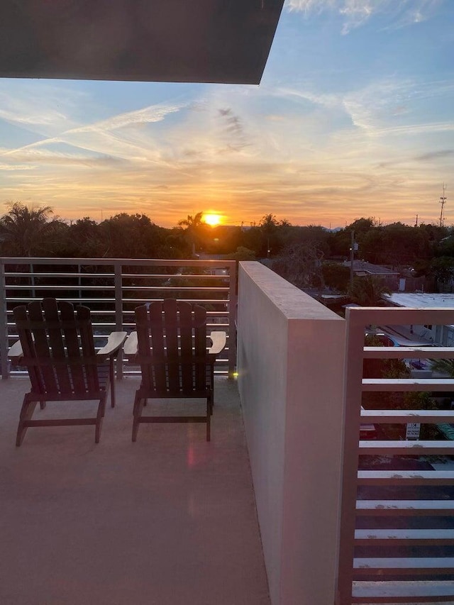 view of balcony at dusk