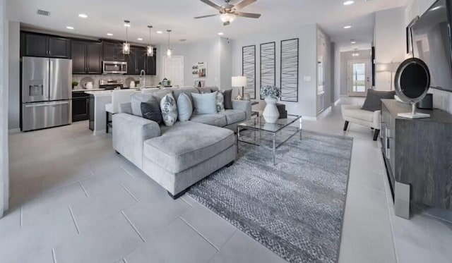 tiled living room featuring ceiling fan