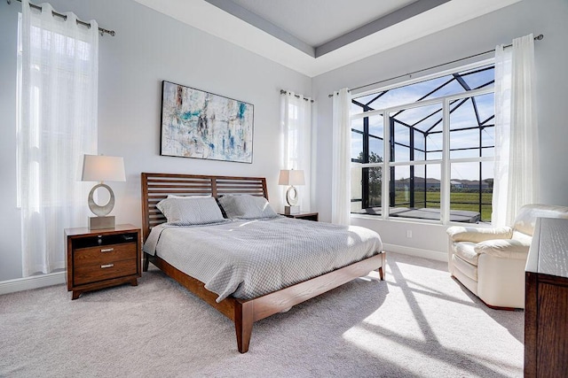 bedroom featuring light carpet