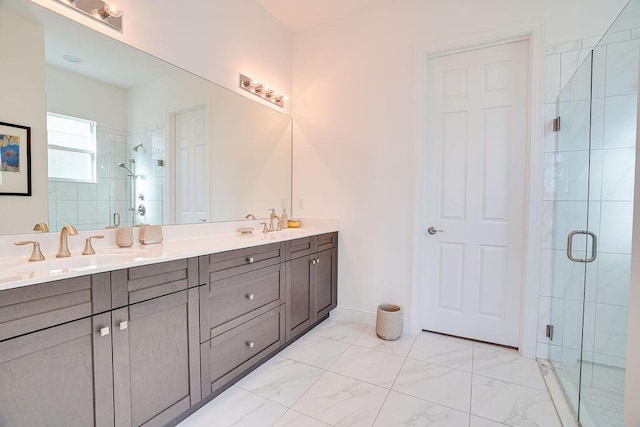 bathroom with vanity and a shower with shower door